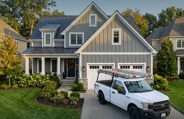 Clean home exterior with bright siding and walkway